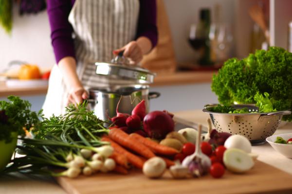 "Cooking and nutrition instructor with vegetables"